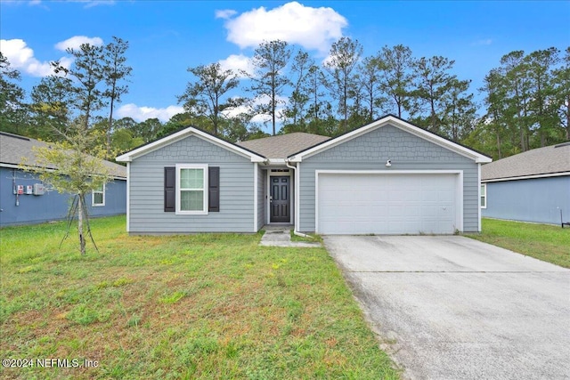 ranch-style house with a garage and a front lawn