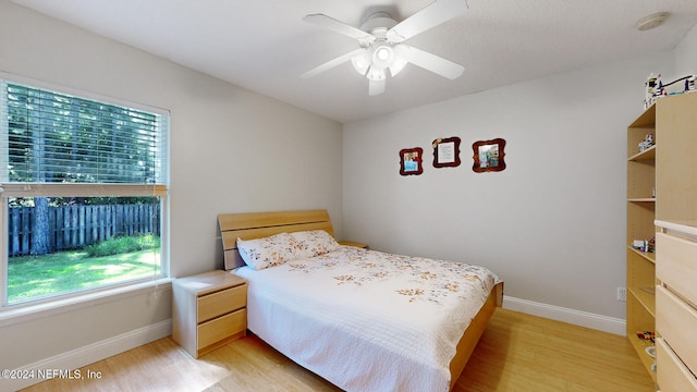 bedroom featuring ceiling fan and light hardwood / wood-style flooring