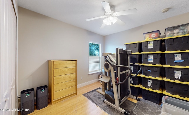 interior space with ceiling fan