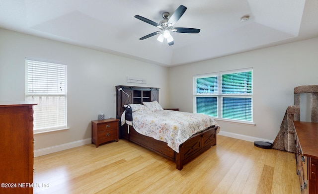 bedroom featuring light wood-type flooring and ceiling fan