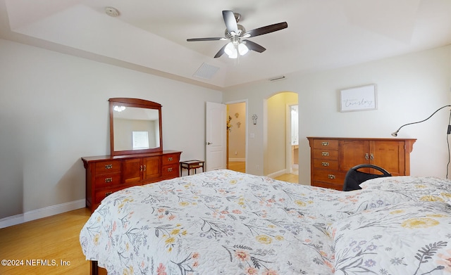 bedroom with ceiling fan and light wood-type flooring