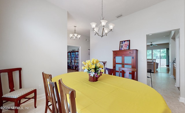 dining room featuring ceiling fan with notable chandelier