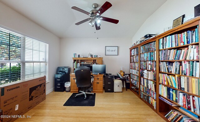 office area featuring ceiling fan, vaulted ceiling, and light hardwood / wood-style floors