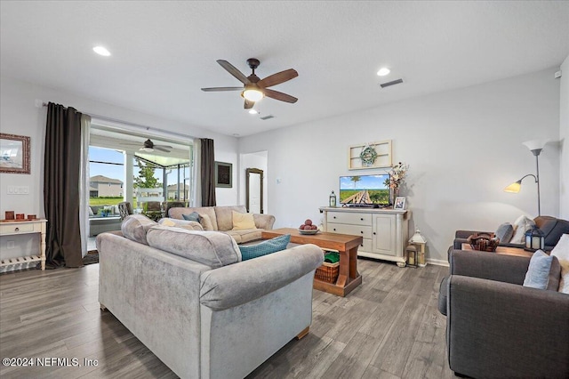 living room with hardwood / wood-style floors and ceiling fan