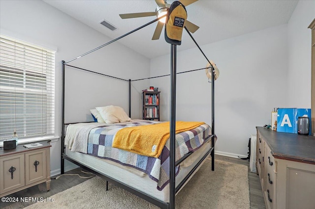 bedroom featuring dark hardwood / wood-style flooring and ceiling fan