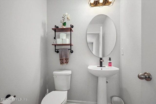 bathroom featuring toilet