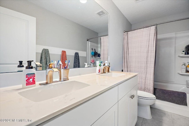 full bathroom with shower / bath combo, tile patterned flooring, a textured ceiling, toilet, and vanity