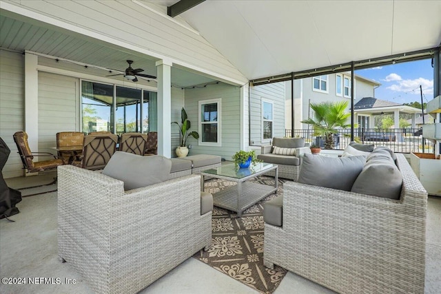 sunroom with vaulted ceiling with beams and ceiling fan