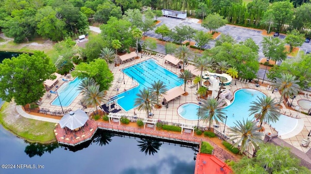 birds eye view of property with a water view