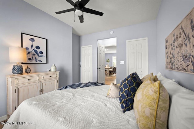 bedroom with ceiling fan and wood-type flooring