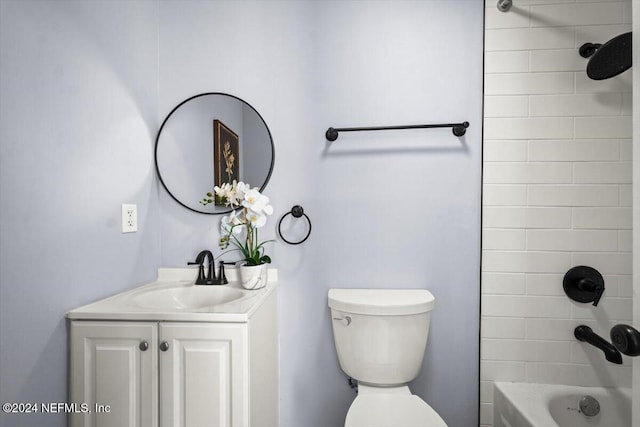 full bathroom with vanity, toilet, and tiled shower / bath combo