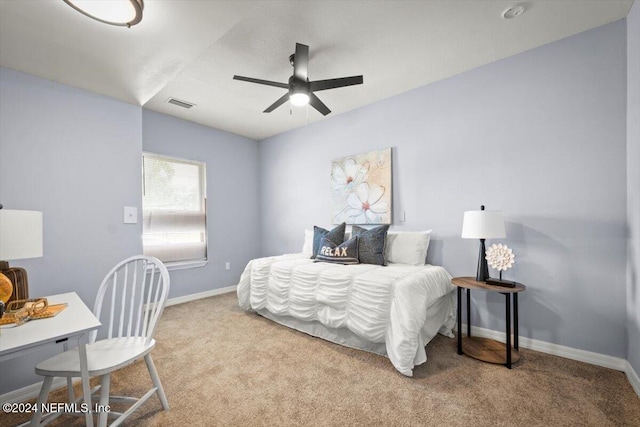 bedroom with ceiling fan and light carpet