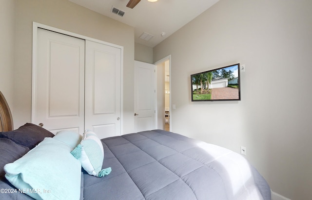 bedroom featuring ceiling fan and a closet