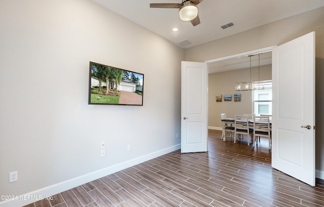 empty room with wood-type flooring and ceiling fan