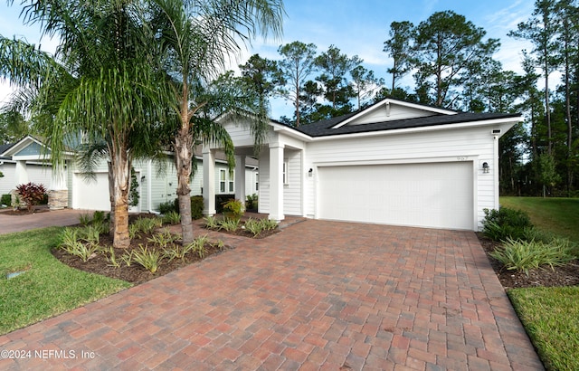 ranch-style house featuring a garage