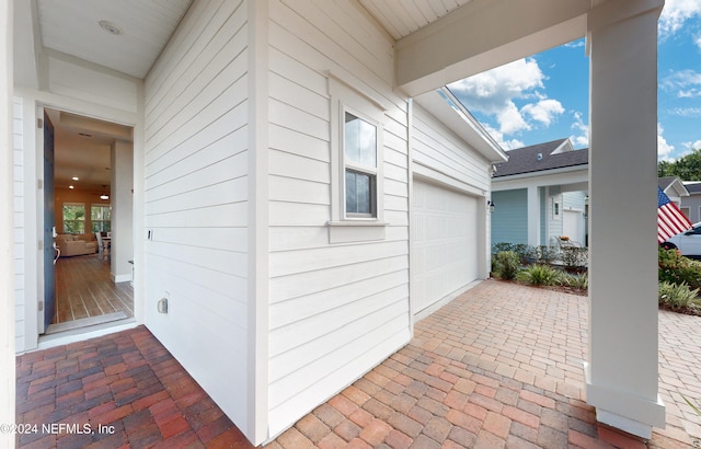 view of patio / terrace featuring a garage