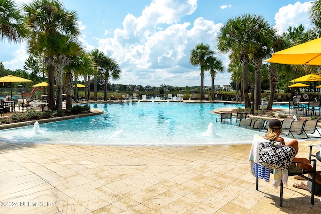 view of pool featuring a patio area and pool water feature