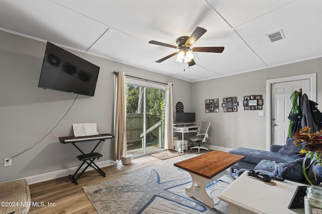 office with ceiling fan, wood-type flooring, and crown molding