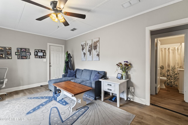 living room with ceiling fan, crown molding, and dark hardwood / wood-style flooring