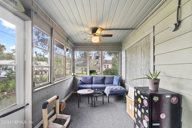 sunroom / solarium featuring ceiling fan