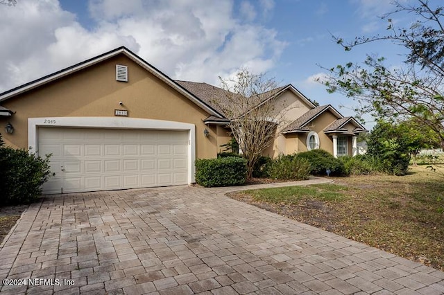 ranch-style house featuring a garage