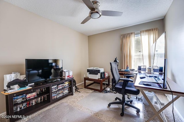 office area with ceiling fan, light colored carpet, and a textured ceiling