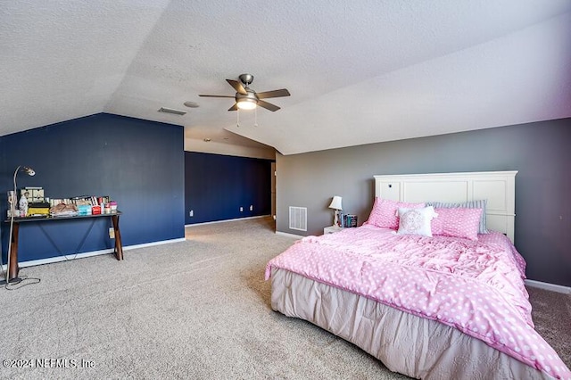 bedroom featuring vaulted ceiling, carpet, ceiling fan, and a textured ceiling