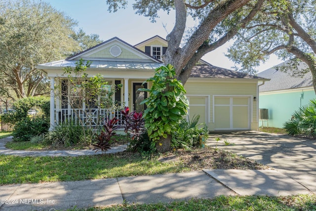 view of front of property featuring a garage and covered porch