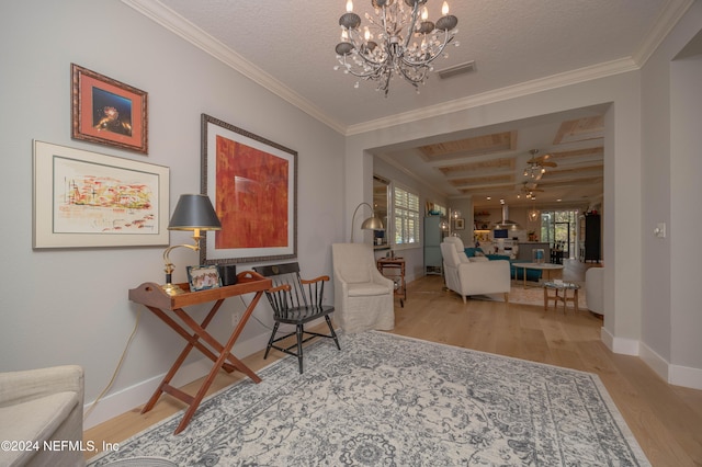 living area with crown molding, light wood-type flooring, coffered ceiling, an inviting chandelier, and beamed ceiling