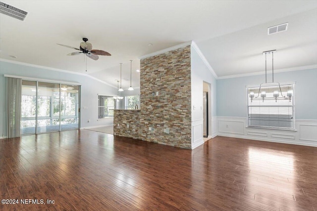 unfurnished living room with lofted ceiling, dark hardwood / wood-style floors, and crown molding