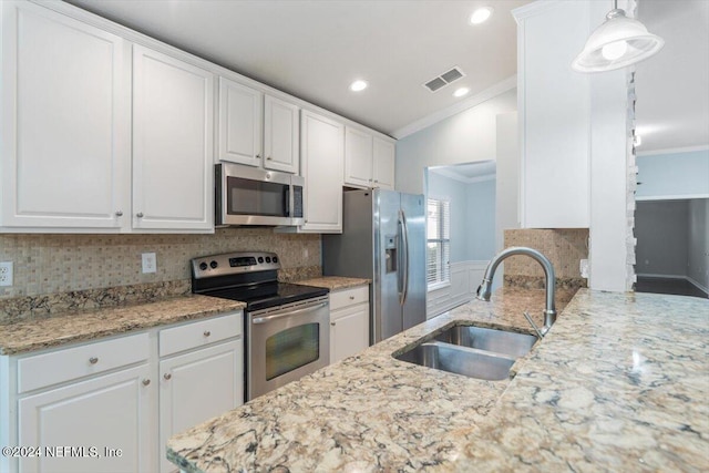 kitchen with appliances with stainless steel finishes and white cabinets