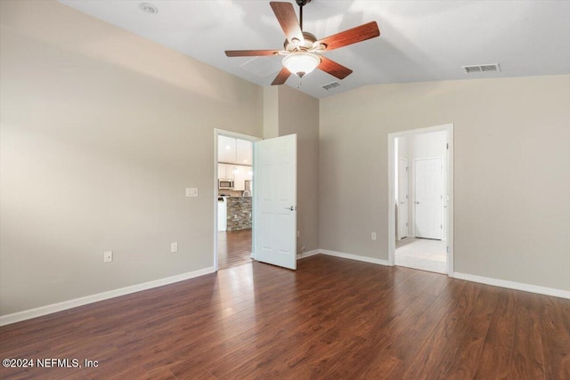 unfurnished room featuring hardwood / wood-style flooring, ceiling fan, and vaulted ceiling