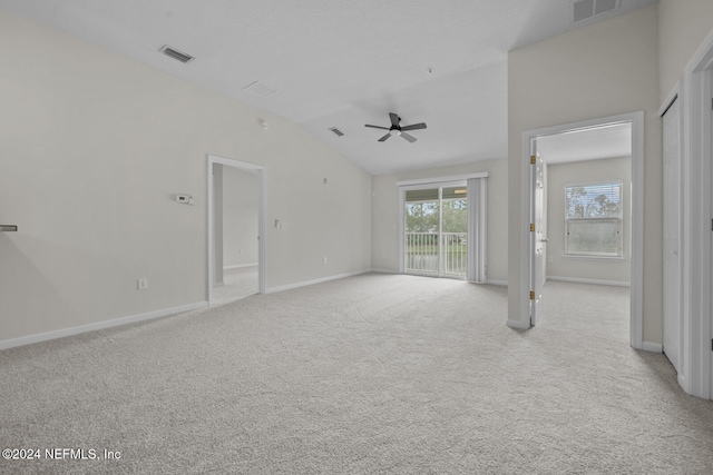 unfurnished living room featuring light colored carpet, lofted ceiling, and ceiling fan