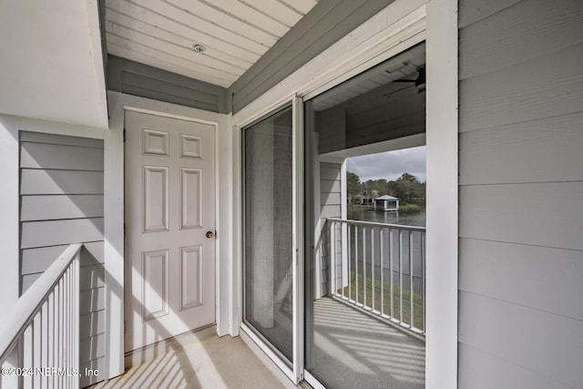 view of exterior entry featuring a balcony