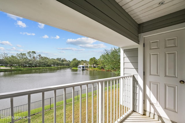 balcony featuring a water view