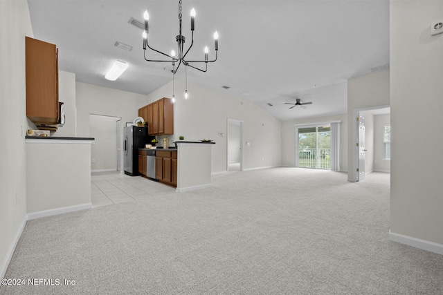 unfurnished living room with ceiling fan with notable chandelier, lofted ceiling, and light carpet