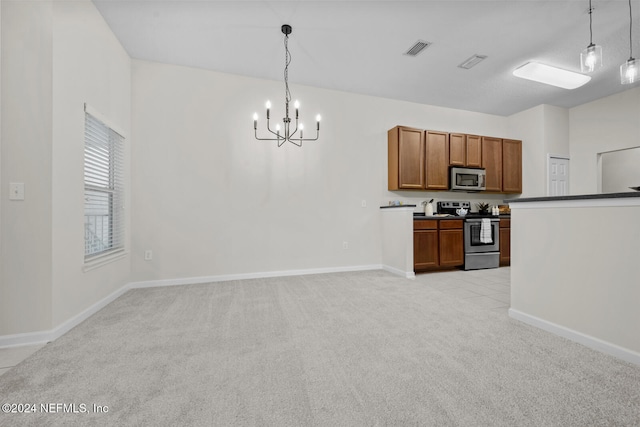 kitchen featuring stainless steel appliances, light colored carpet, decorative light fixtures, and a notable chandelier