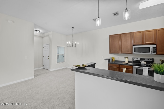 kitchen featuring stainless steel appliances, an inviting chandelier, light carpet, and pendant lighting