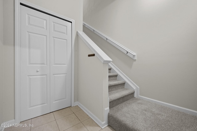 staircase with tile patterned flooring