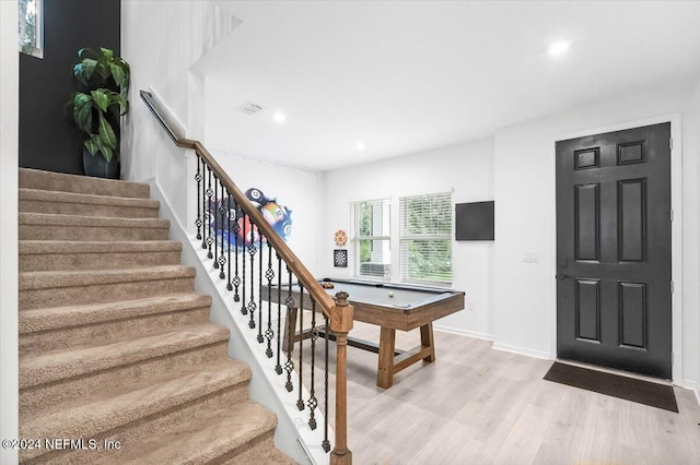 entryway featuring light wood-type flooring and pool table