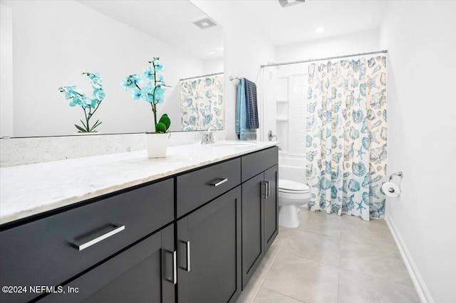 full bathroom with shower / bath combo, vanity, tile patterned floors, and toilet