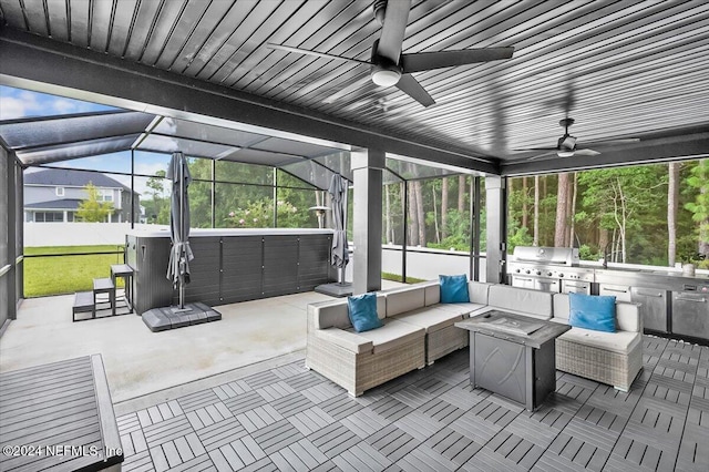 sunroom / solarium featuring a healthy amount of sunlight, a jacuzzi, and vaulted ceiling with beams