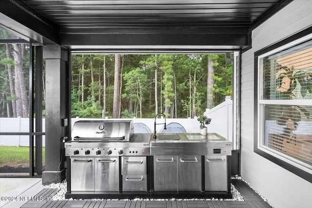 sunroom with wooden ceiling and a healthy amount of sunlight