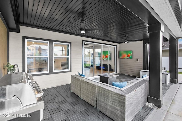 view of patio / terrace featuring an outdoor kitchen, ceiling fan, a grill, and an outdoor living space