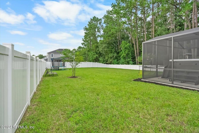 view of yard featuring a trampoline