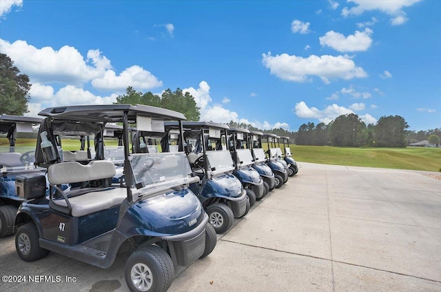 view of vehicle parking featuring a lawn