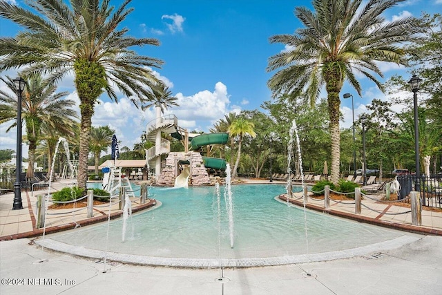 view of pool with pool water feature