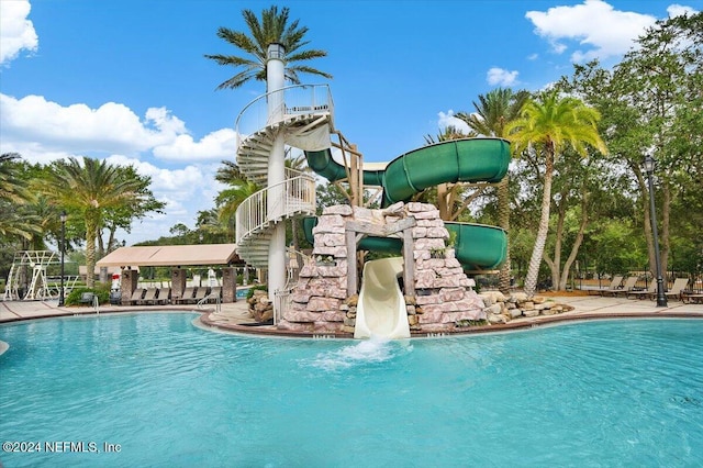 view of swimming pool featuring a water slide