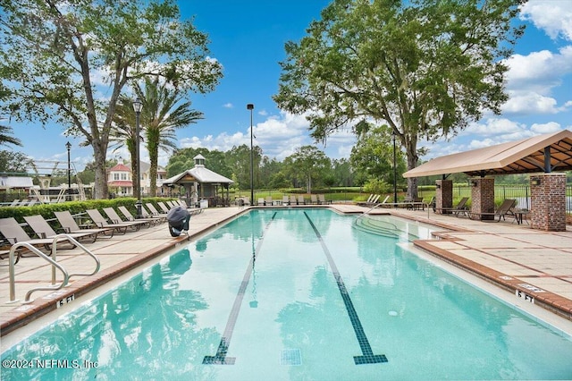 view of swimming pool with a patio