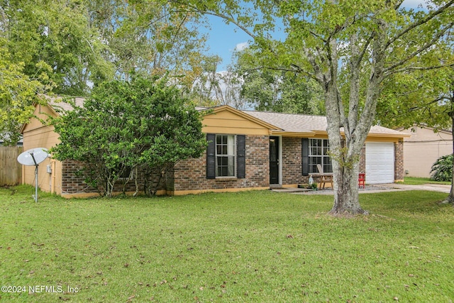 ranch-style house with a garage and a front yard